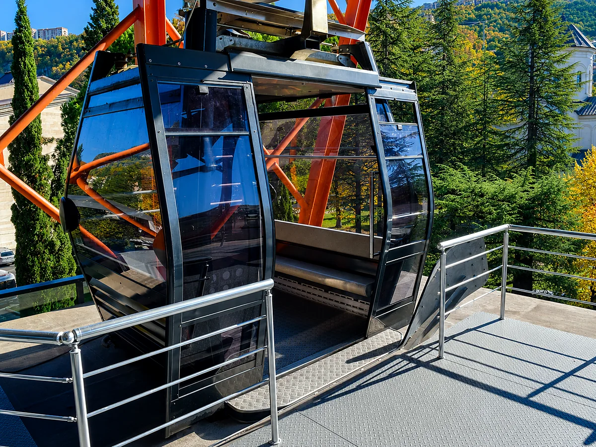 A modern glass cable car cabin at a station in Chiatura, Imereti, Georgia