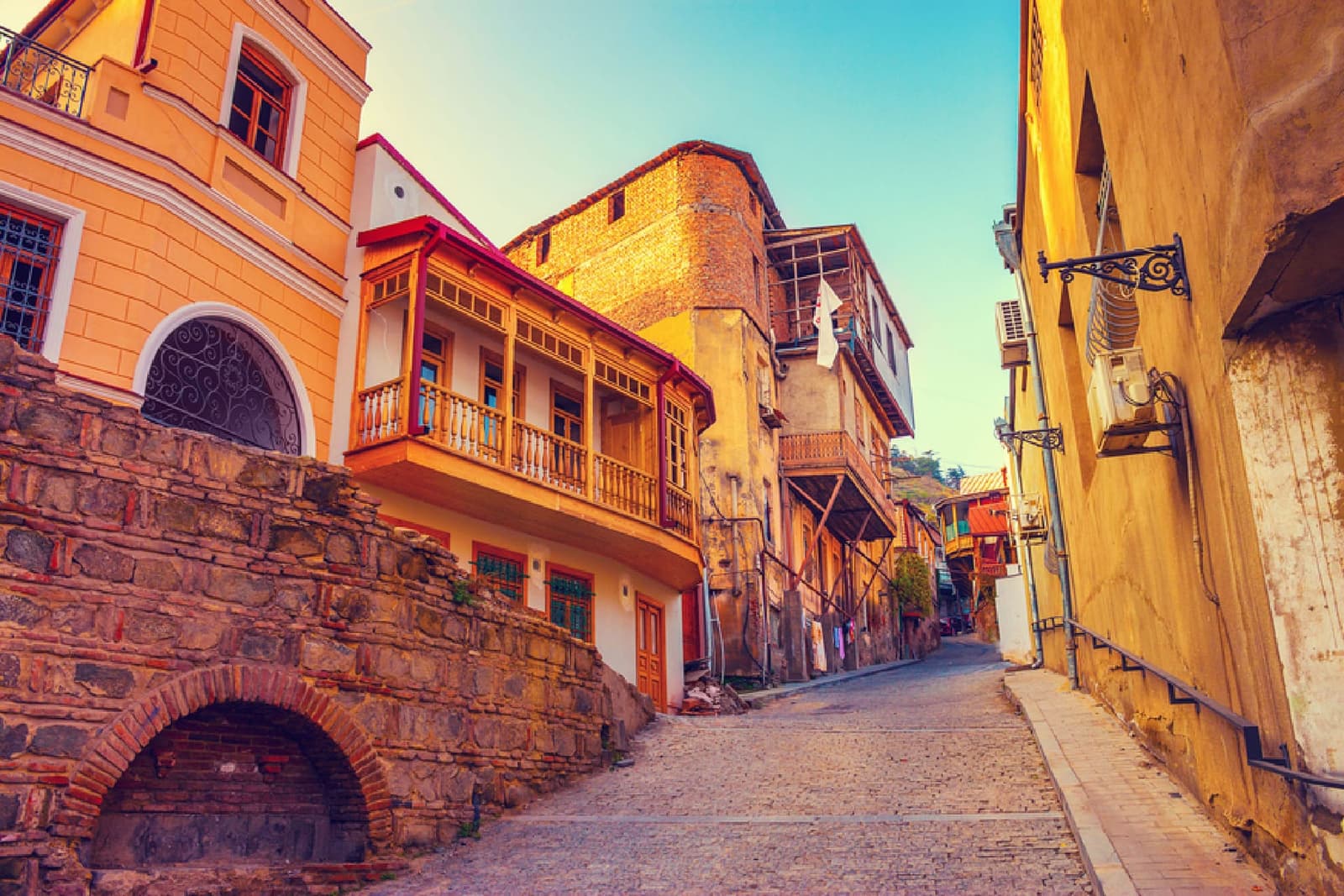 Cobbled street in Tbilisi’s Old Town with carved wooden balconies