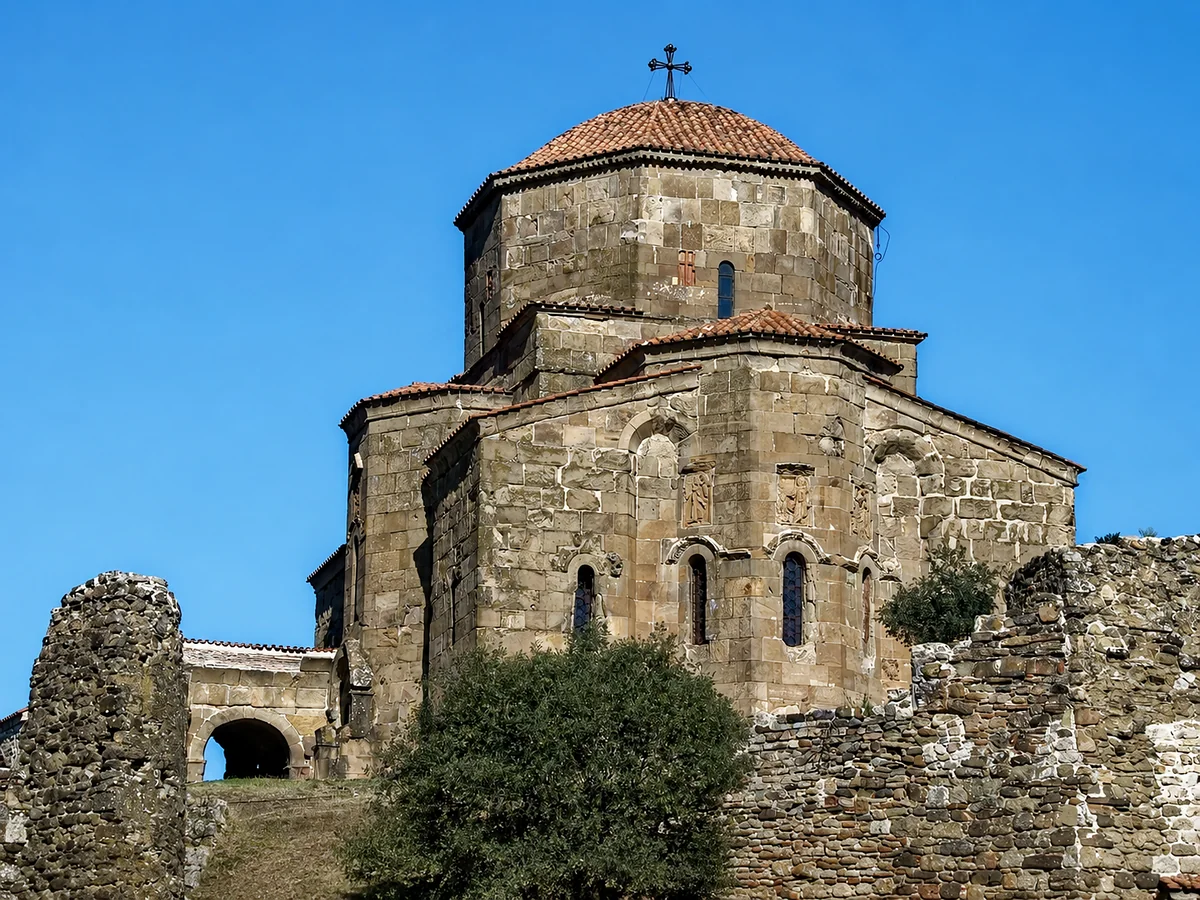 The dome of Jvari Monastery above the ruined walls of its enclosure, Mtskheta-Mtianeti, Georgia