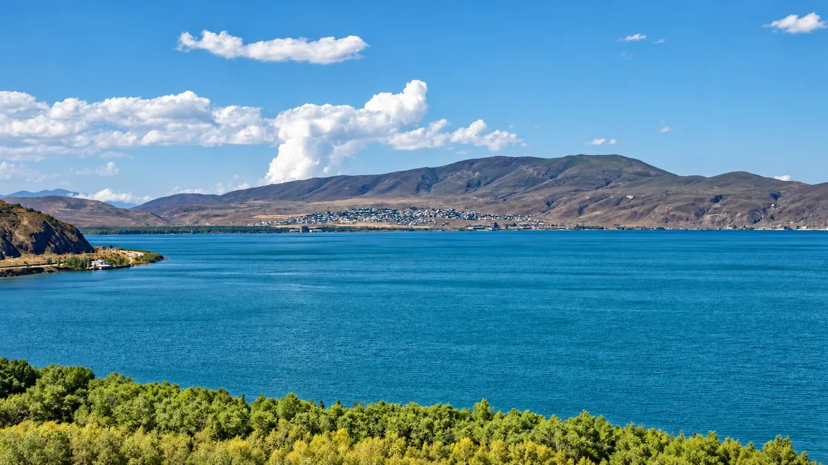 The blue water of Lake Sevan with mountains along the far shore