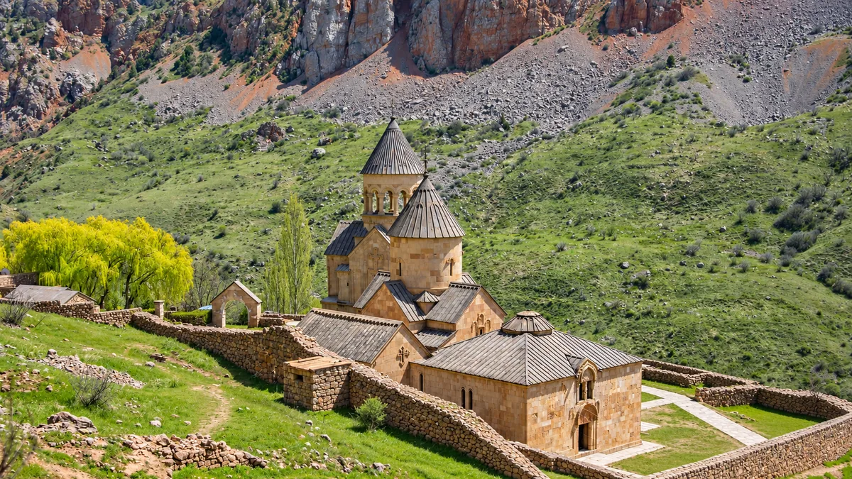 Noravank Monastery beneath the red cliffs of the Amaghu Gorge in Vayots Dzor