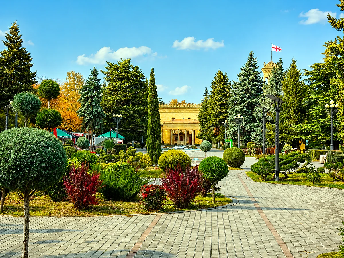 A landscaped park with paved paths in central Gori, Shida Kartli, Georgia