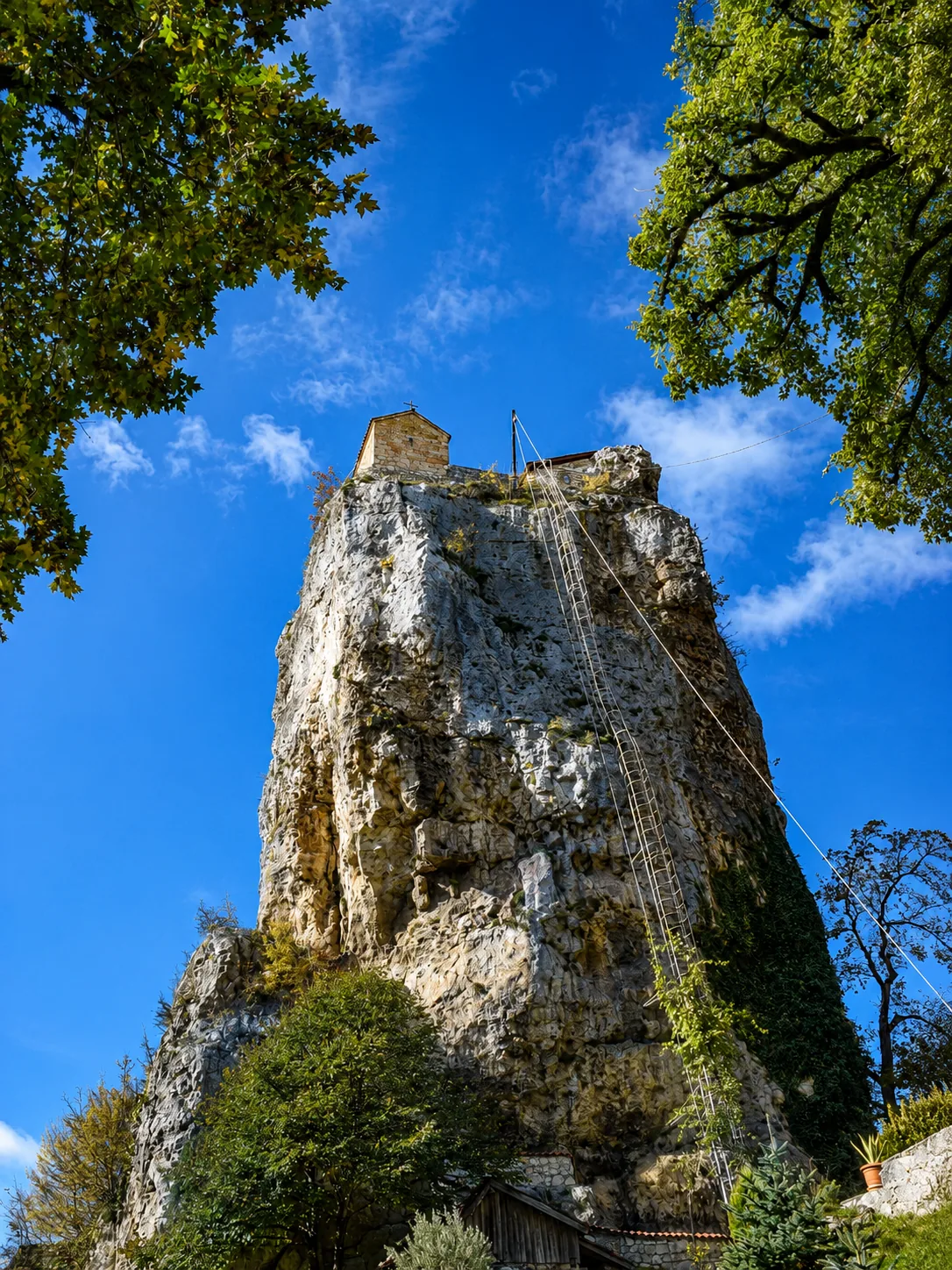 The Katskhi Pillar, a natural limestone monolith topped by a small church, in Imereti, Georgia
