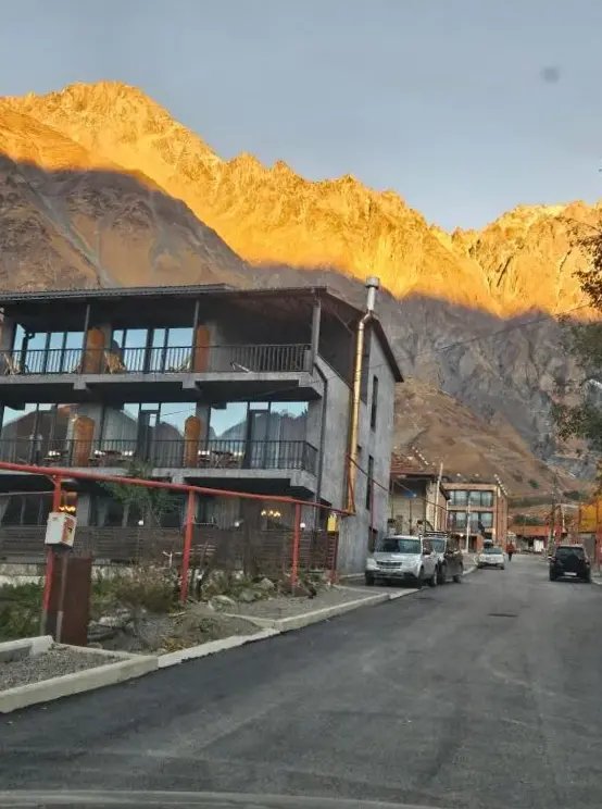 Best View Kazbegi hotel building exterior in Stepantsminda with Caucasus mountain backdrop